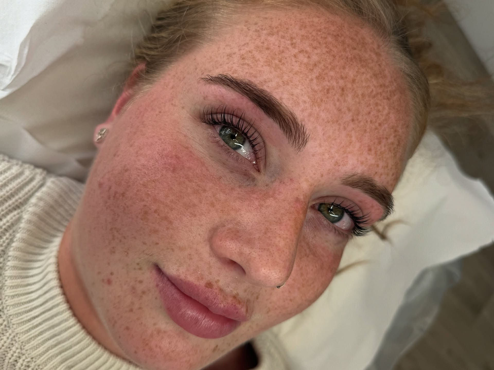 Elite Cosmetics client showing soft, natural brows and lashes